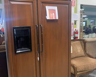 GE Monagram refrigerator with custom cabinet front