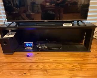 #11	Black Laminate TV Stand - 57x17x17	 $30.00 			
