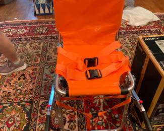 #20	Orange Chair to Stretcher  Emergency Transport Chair (new in Box) Line 2 Design   	 $150.00 			
