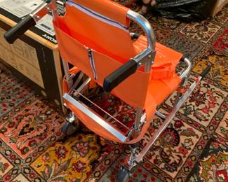 #20	Orange Chair to Stretcher  Emergency Transport Chair (new in Box) Line 2 Design   	 $150.00 			
