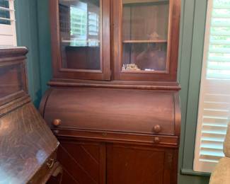 #82	Antique Desk w/2 glass doors & peg Sides  w/cubbies & 2 doors on the bottom and Shelf  - 1" Shelf  (Center Piece is stuck and center can't pull out)   48x22x89T - 2 pc - You Move	 $425.00 			
