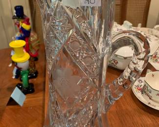 #152	Heavy crystal pitcher etched with flowers 12"	 $20.00 			
