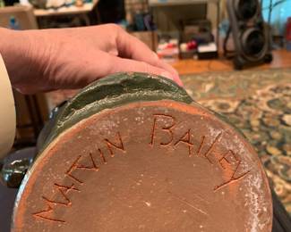 #211	Ugly man green pottery jug by Matvin Bailey 10 inches tall	 $150.00 			
