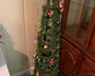 #221	49 inch tall christmas tree great to put special orniment on comes with some ornaments	 $20.00 			
