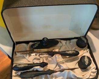 #226	8 piece manicur set with black and silver handles in a black case 	 $23.00 			
