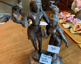 #228	9 inch tall brass statue of Hindu 	 $50.00 			
