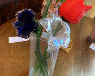 #237	7 piece blown glass flower in clear vase 	 $20.00 			
