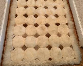 #251	white and tan fur rug 43x51 clean in great shape	 $100.00 			
