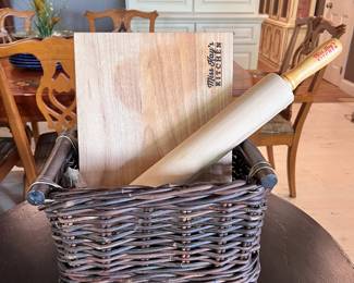 Two handled basket with Miss Kay’s Kitchen items:  rolling pin, cutting board, bamboo trivet, chip clip, wooden spoon and fork, etc…
