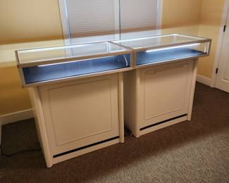 2-Professional retail jewelry cases. Locked and lighted . Case is 39-1/4” wide by 24” front to back by 7-1/2” high. Add pedestal overall height is 42”. Pedestal is 33-1/2” by 21” front to back by 35” high