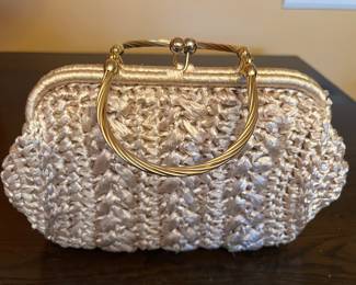 “It’s In the bag”vintage straw purse. Brass handles.