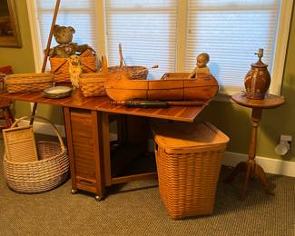 Longaberger basket collection. Teak table. 62” wide (with leaves extended) by 24” deep by 28” high.  With leaves dropped, table is 11” wide.