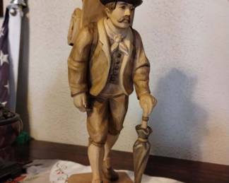 $150.00 
traveling clock salesman wooden figurine, approximately 15x5x5