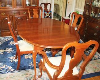 Hitchcock Furniture Dining Table with 3 Leafs and table pads.  Also, 5 Hitchcock Furniture Chairs.  Table and Chairs are available separately.