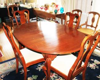 Hitchcock Furniture Dining Table with 3 Leafs and table pads.  Also, 5 Hitchcock Furniture Chairs.  Table and Chairs are available separately.