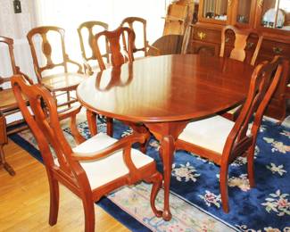 Hitchcock Furniture Dining Table with 3 Leafs and table pads.  Also, 5 Hitchcock Furniture Chairs.  Table and Chairs are available separately.