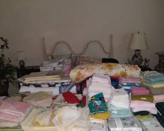 LOTS of bedding, quilts, towels, etc. 