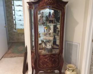 Satin inlay curio cabinet, collection of Emmett Kelly clowns