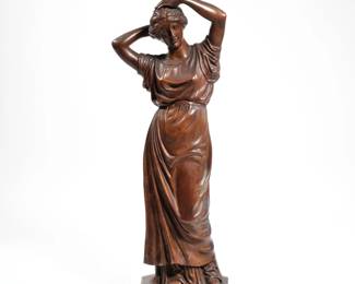 ANTIQUE CARVED WOOD FIGURE | An antique intricately carved wood figure of a woman, no apparent signature. h. 21 in.