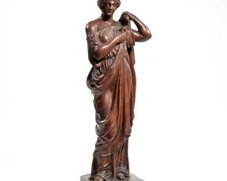 ANTIQUE CARVED WOOD FIGURE | An antique intricately carved wood figure of a woman donning a robe, no apparent signature - h. 21.25 in.