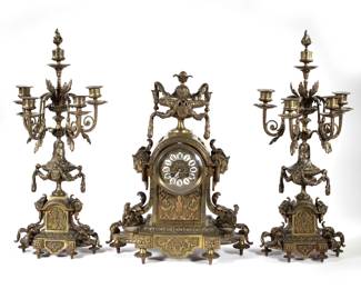 (3pc) G. PHILIPPE FRENCH BRONZE CLOCK GARNITURE | Including a clock, marked "G. Philippe" on the movement, with enameled plaque Roman numeral markers and two four-arm candelabras, all with scrolling acanthus and figural mounts - l. 15 x w. 6.5 x h. 18.5 in. (clock)