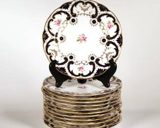 (12pc) COALPORT / TIFFANY & CO. PLATES | Each with hand-painted roses and borders of cobalt and gilt scroll decoration, marked "England Coalport / Leadless Glaze / Tiffany & Co. New York" - dia. 9 in.