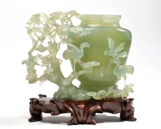 RETICULATED CARVED JADE VESSEL | On a conforming carved wood stand - l. 7 x w. 3 x h. 5.5 in. (Jade only)