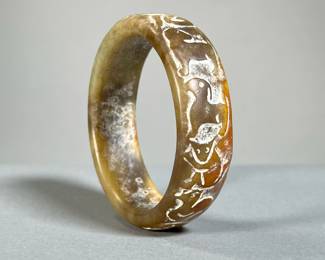 CHINESE ZODIAC HARDSTONE BANGLE BRACELET | Carved hardstone bangle bracelet decorated with the twelve animals of the zodiac - interior dia. 2.5 in. - dia. 3.13 in.