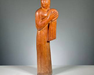 ATTRIB. LINTON (20TH CENTURY) | Female figure with drum. Modernist carving depicting a woman holding a drum - h. 19.5 in.
