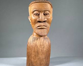 LARGE WOODEN BUST | Hand-carved wooden bust of a man's head. - l. 7 x w. 7 x h. 21 in.