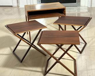 ILLUM WIKKELSO TEAK SNACK TABLES | Illum Wikkelso (Danish, 1919-1999). For Selig, a suite of three folding snack tables within a side table case - l. 23.25 x w. 15.75 x h. 20 in.