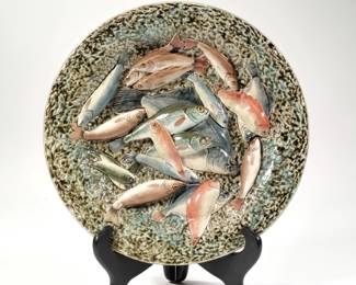 PALISSY WARE FISH PLATE | A majolica plate decorated with various fish in high relief, marked with an impressed "C D" - dia. 11.5 in.