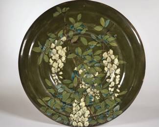 ROZENBURG DEN HAAG CHARGER | C. 1895. With green glaze, signed on the bottom and numbered 328
 - dia. 15.25 in. 
