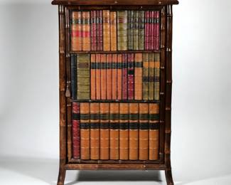 VICTORIAN BAMBOO BOOK CABINET | Side cabinet with a single faux book front door revealing three interior shelves, bamboo frame with paint decorated top - l. 22 x w. 16.5 x h. 34 in. (overall)