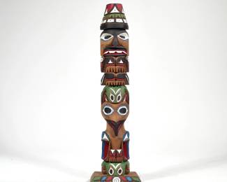 RICK WILLIAMS DITIDAHT RED CEDAR TOTEM | Seattle, WA; Ditidaht First Nation Totem pole by Rick Williams, brother of John T Williams. This red cedar totem is hand carved and painted, showing in order: Watchman, Frog, Raven, Frog. Carved on back " 18"Red Cedar. / Watchman. / Frog. / Raven. / Frog. / Hand carved by Rick Williams. / Nitinaht" - l. 5.5 x w. 4 x h. 19 in.