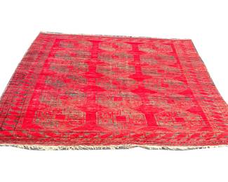 RED & GRAY PATTERN RUG | Having three rows of octagonal medallions on red ground within a patterned border - l. 126 x w. 89 in.