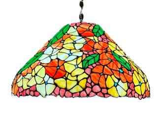 MONUMENTAL STAINED GLASS SHADE | Colorfully decorated patterned stained glass hanging shade with yellow, purple, and red/orange flowers among green leaves. 