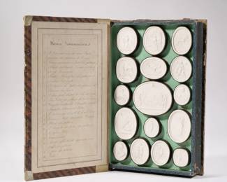 GRAND TOUR PLASTER INTAGLIO COLLECTION | Studio of Pietro Paoletti: Liberate Importante Museo Sommariva: nineteen plaster cast medallions, mid-19th century, in a book-form box - w. 6.5 x h. 10.25 in. (box)