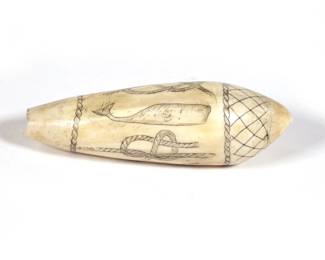 SCRIMSHAW CARVED WHALE TOOTH | An antique folk art carved whale's tooth decorated with various examples of knots, a hook, and a sperm whale within bands of rapes and cross-hatching at the top - l. 4.25 in.