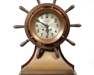 BAILEY BANKS & BIDDLE SHIP'S BELL CLOCK | Yacht wheel ship's clock, art nouveau bronze numerals on a silver dial with open work hands - l. 7.5 x w. 14.5 x h. 18 in.