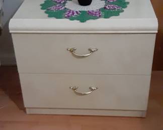 Bedside table.  Lots of vases and glassware available. 