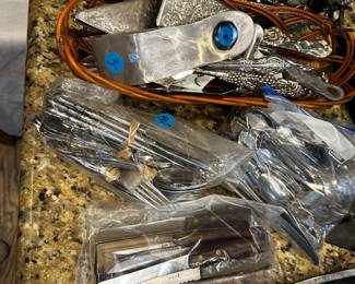 Lots and lots of kitchen utensils. Many are brand new in the package!