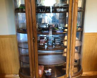 Carved front, footed oak display cabinet