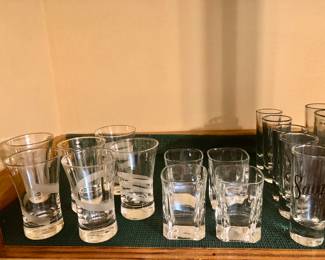 Large collection of shot glasses