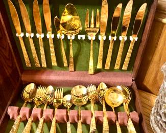 Gold tone flatware set