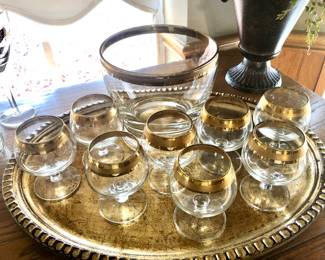 Gold rim glasses and ice bucket