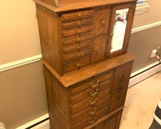 Stunning turn of the century oak antique dental / jewelry cabinet