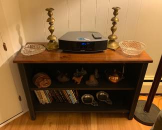 Book shelf, Bose radio, candle sticks, books