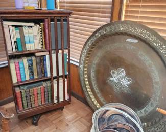 Rotating library shelf filled with vintage books