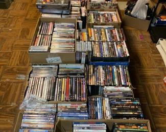 Hundreds of DVDS many are sealed